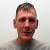 Father-of-two stabbed an armed intruder to death to protect his partner and children after masked gang burst into his home and started beating him: Five men are jailed