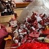 Inside eerie 'Chinese Lapland' where army of workers produce 80% of the world's Christmas decorations with mountain of stock piled floor to ceiling in 'never-ending nightmare' grotto