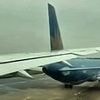 Boeing passenger plane SLICES tail of another jet on runway of major airport