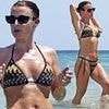 Coleen Rooney shows off her Ibiza tan in a colourful crochet bikini as she enjoys beach day with Wayne and fellow WAG Lisa Carrick
