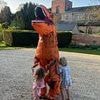 Look who got T-Rexit done! As politician dresses as an orange dinosaur for his son's Jurassic Park themed birthday party, can YOU guess who it is?