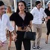 Nicola Peltz appears strained as she steps out with husband Brooklyn Beckham in sun-soaked St Tropez amid ongoing family feud