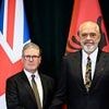 How Albania's 6ft 7in former basketball player Prime Minister towered over Keir Starmer on his day of humiliation as his long-awaited migrant crackdown crumbled live on TV
