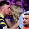 Luke Littler celebrates making darts history - and £200k payday - on stage with his girlfriend... after confirming relationship with subtle gesture on live TV