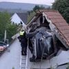 Car crashes into a barn's roof in Germany, seriously injuring 2