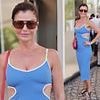 Helena Christensen, 56, shows off her enviable figure in a plunging blue dress as she leaves her hotel at the Cannes Film Festival