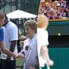Kate's wave of solidarity: Princess of Wales shares poignant moment with young cancer patient, 11, at Wimbledon final