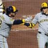 Yelich homers twice and the Brewers hold off the Pirates 8-5 after a long rain delay