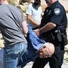 Elderly man hauled away by cops after Charlie Kirk shooting in Utah was local political agitator