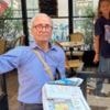 France's last newspaper hawker gets Order of Merit from his old customer - President Macron