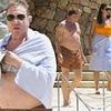 Duran Duran singer Simon Le Bon, 66, enjoys a dip in the ocean alongside his swimsuit-clad wife Yasmin during luxurious holiday in France