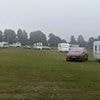 Travellers with around 30 caravans pitch up in leafy Surrey park - and police are powerless to evict them