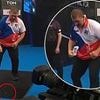 Watch the incredible moment darts star loses a TOOTH while celebrating victory in World Cup match