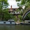 We were thinking about downsizing - but instead decided to splash out on a £3million mansion on an abandoned private island on the Thames