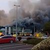 Three people are arrested after huge inferno rips through Dunelm and Pets At Home stores