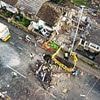 Two men arrested on suspicion of stealing metal from an empty house - which then exploded and was completely destroyed