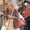 Kate Moss' £35k doggy bag! Model uses her pricey Birkin to pick up her pet's poop as she enjoys a stroll with pal Sarah Nimmo in Mayfair