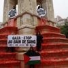 Des ONG teignent en rouge la fontaine des Innocents, à Paris, pour dénoncer le "bain de sang" à Gaza