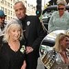 Fat Tony's wedding kicks off in style as DJ, 58, arrives flanked by longtime pal Boy George for his London nuptials before exchanging vows with Stavros Agapiou, 32