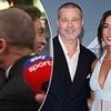Brad Pitt interview is gatecrashed by F1 star at Times Square premiere of new film - as duo joke about their outfits on the back of Mercedes star's Canadian Grand Prix win