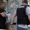 Three Albanians and a Moldovan woman are arrested in dawn raids targeting people smuggling ring 'who advertised illegal crossings on social media'