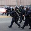 Riot police and protesters clash after LA immigration raids