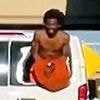 Wild moment shirtless inmate in handcuffs hangs out the broken window of prison van while speeding down highway