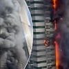 Dramatic moment huge inferno rips through 67-storey Dubai skyscraper with 4,000 residents as debris falls from the sky