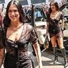 Dua Lipa sets pulses racing in a sheer black lace mini dress as she greets fans at the opening of her merchandise pop-up shop in London