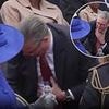 Keir to the rescue! Prime Minister springs into action to hand Queen Camilla a bottle of water during VE Day military procession