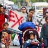 About 300 migrants start walk north from southern Mexico. Their goal is not the US border
