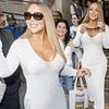 Mariah Carey displays her jaw-dropping curves in a figure-hugging white crochet dress as she leaves her hotel in London
