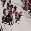 Shocking moment cycle race ends in disaster when police motorcyclist rides across sprint finish, sparking huge crash