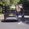 Instant karma! Moment raging motorist speeds past learner with crazy overtake - only to drive straight into the hands of armed police
