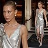Bella Hadid puts on a leggy display in silver midi dress as she leaves her hotel in London