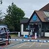 Moment masked gang drive their Volkswagen into a Co-op - before driving off with the cash machine