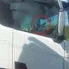 Shocking moment lorry driver is caught with no hands on the wheel as he rolls a cigarette on the motorway