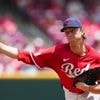 Singer takes shutout into 8th, Reds beat Rays 2-1 for 4th straight win