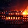 Nepali politician is chased down the street by a lynch mob as Prime Minister's flees and presidential palace is burned to the ground