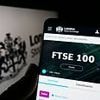 Footsie slips from record high after tariff threats