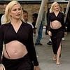 Pregnant Pixie Lott showcases her blossoming bump in slinky black two-piece at Formula E World Championship