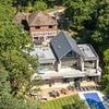 High flying ex-Citibank executive sues builders who 'botched' her dream home for £3million