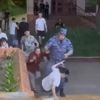 Bloodcurdling moment ruthless soldier cocks his gun & presses it against woman’s temple during restaurant brawl