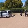 Hilarious moment Macron's delegation speeds away from Windsor Castle with the boot still open sending luggage flying out the back - after his wife rejected him on the steps his airplane