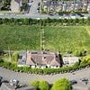 More than 100 residents form human chain to 'hug' bowling green in bid to protect the 'only green space' from developers