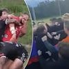 Wild footy brawl kicks off after a woman and man get into physical clash on the sideline following a melee on the field