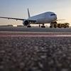 Passengers are seen running across tarmac as they flee jet after 'landing gear caught fire'