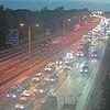 M25 shut by lorry crash: Motorists at standstill in huge queues after truck smashes into a bridge before rush hour