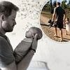 'Daddy's little girl': Meghan Markle shares more unseen snaps of Lilibet on her fourth birthday showing Prince Harry cradling her in his arms and walking together hand-in-hand