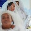 Polygamy and pageantry on display at a mass wedding in South Africa